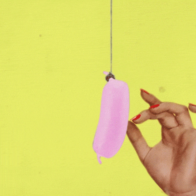 Woman distracted by a sausage animated gif and sound piece, link to surreal animations by Helen Judge 